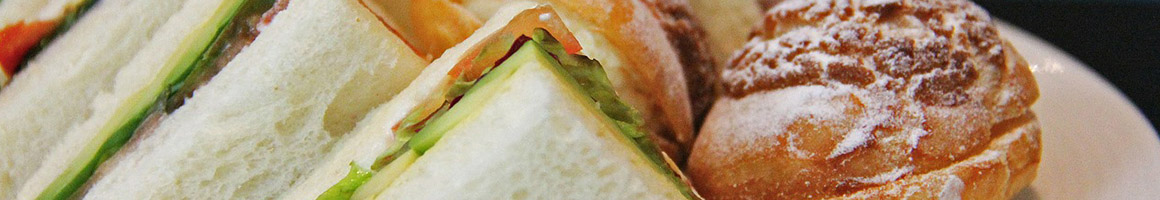 Eating Deli Sandwich at Four Corners of the Earth restaurant in Burlington, VT.